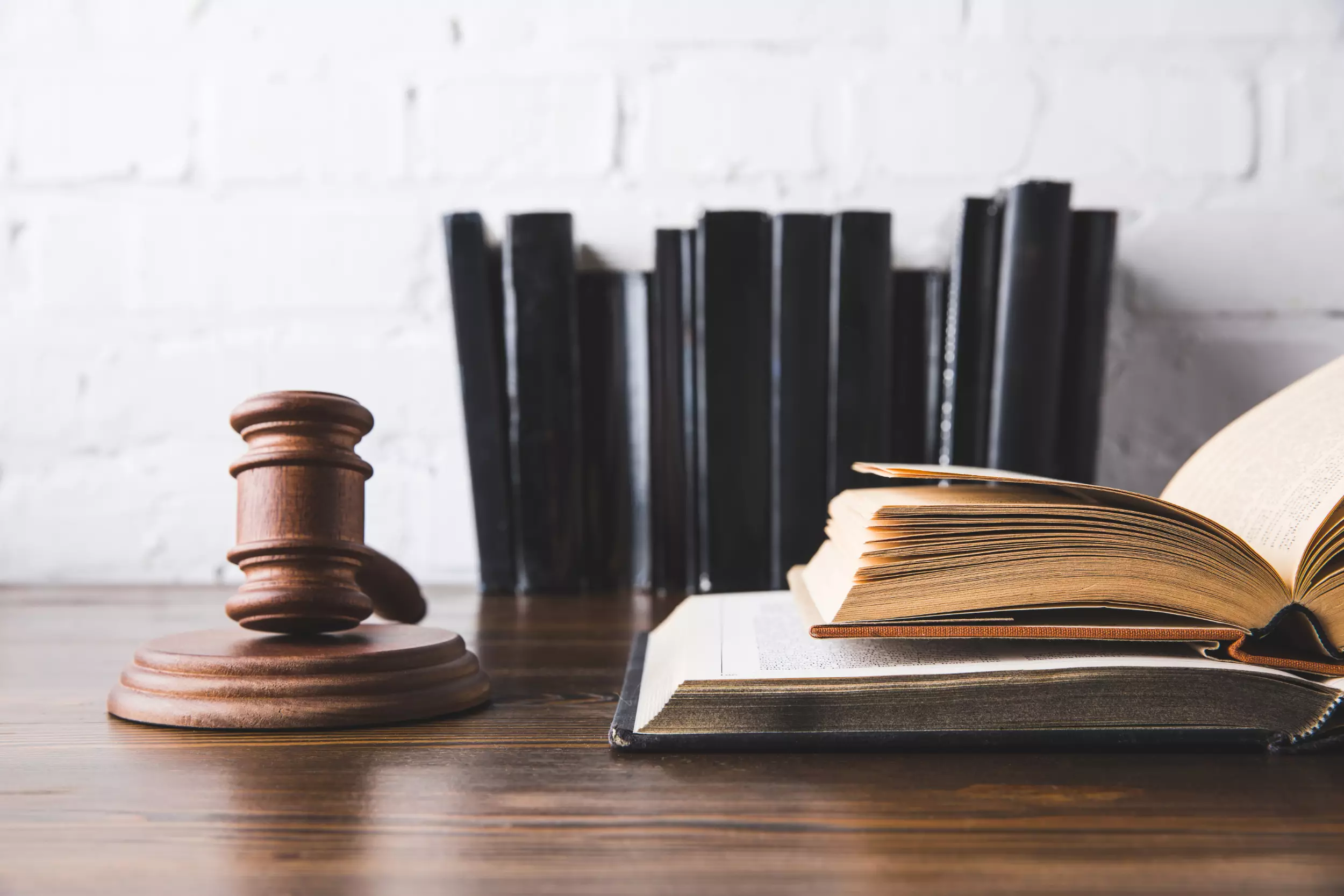 Law books and gavel on desk